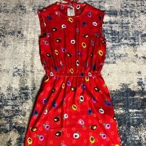 Abstract red dress with pockets, size S, Pit to pit measures 34 inches.